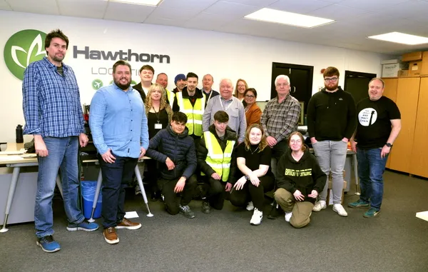 Hawthorn Logistics team celebrating the companyâ€™s 18th birthday in the office